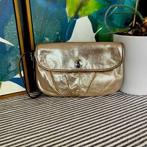 Coach wristlet. Gold-colored